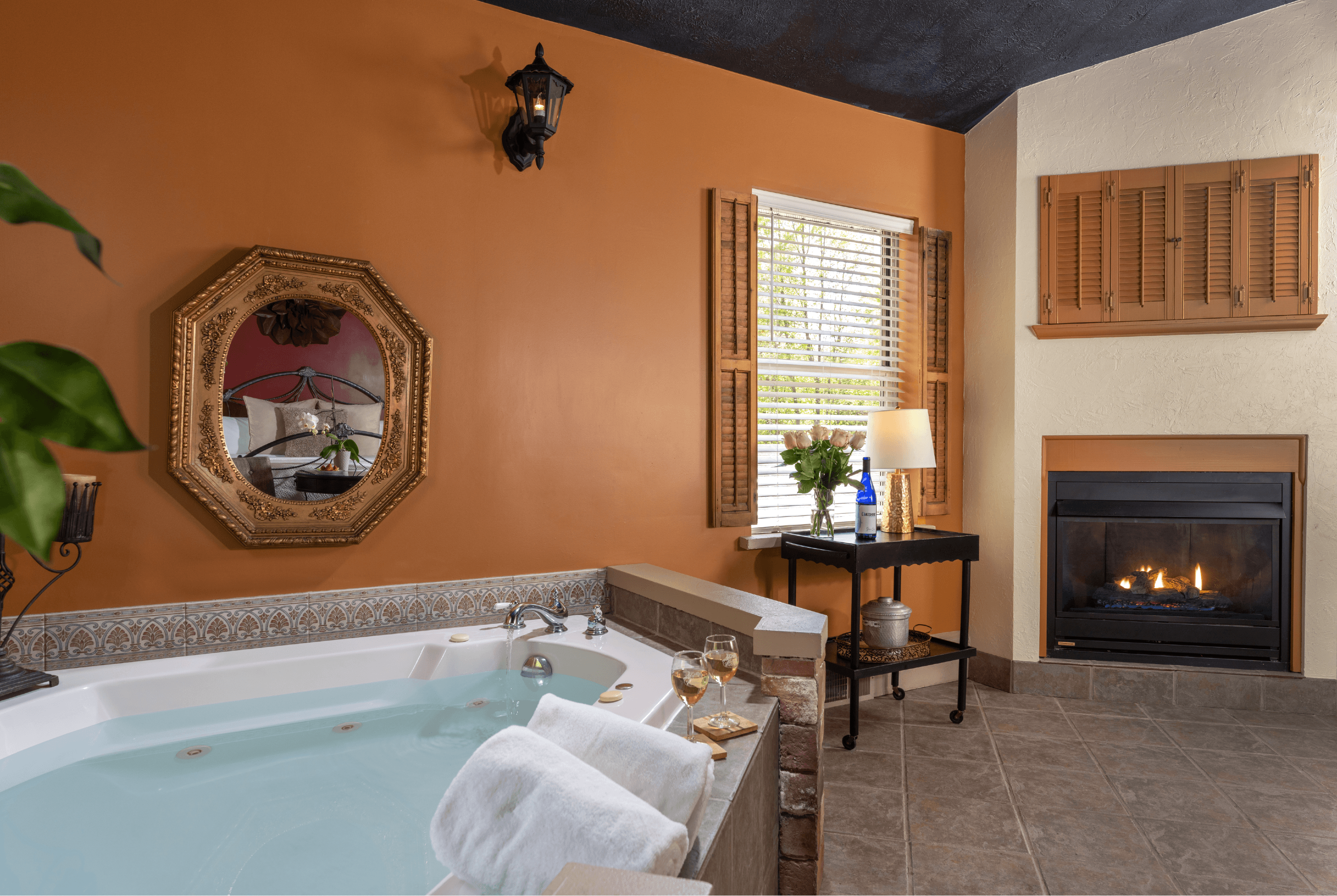 Suite with king bed, two person jetted tub, fireplace and hand-painted ceiling