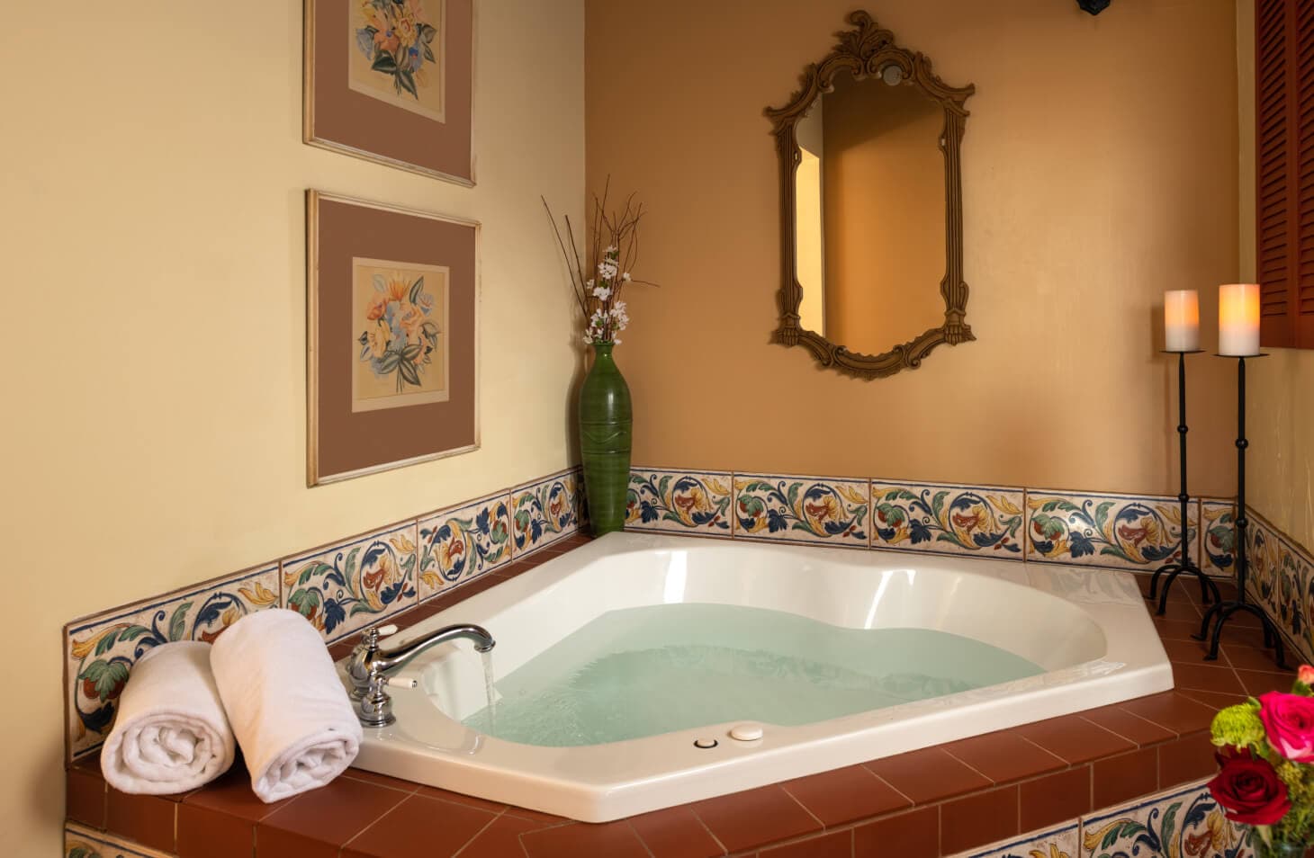 Suite with a two person jetted tub, candles, ensuite bath