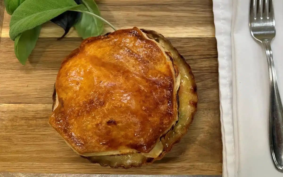 homemade pub pie with fork and napkin