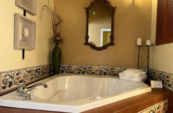 Two person whirlpool tub with a terracotta roof feature.