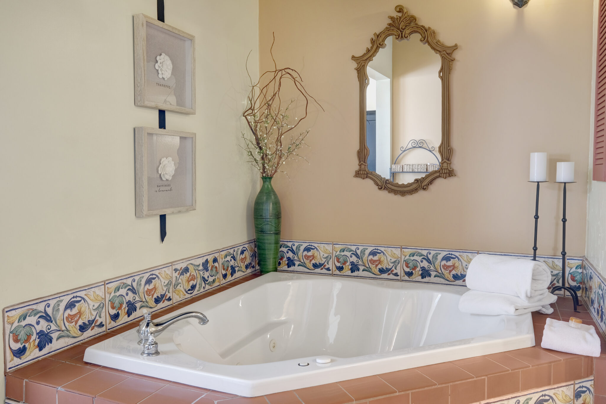 Two person whirlpool tub with a terracotta roof feature.