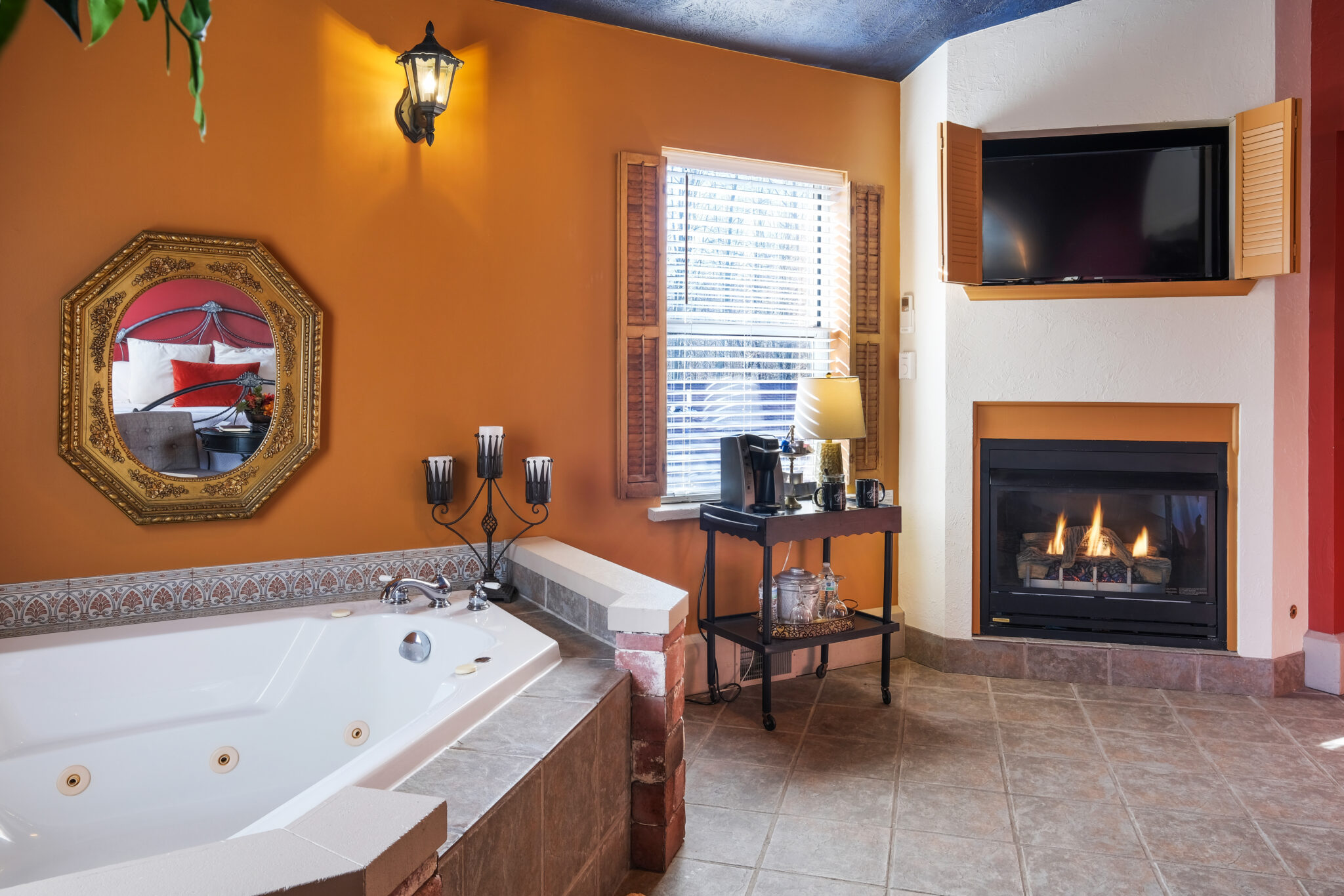 Two person whirlpool tub with a view of the fireplace.