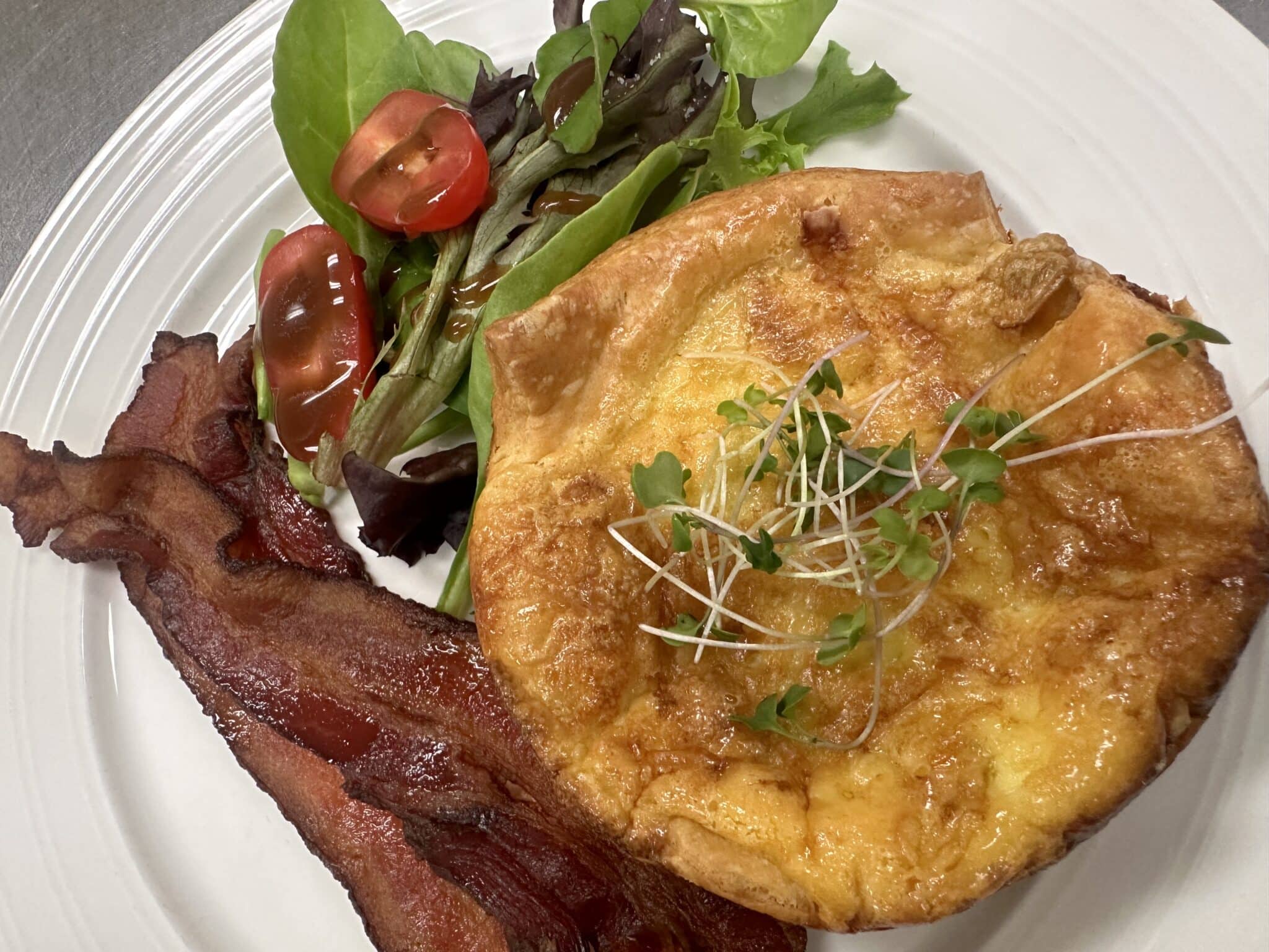 Breakfast galette with bacon and side greens
