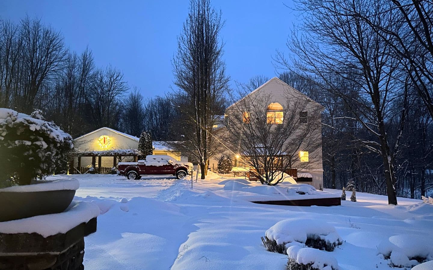 castle keep at dusk with lights glowing on a snowy wintry day