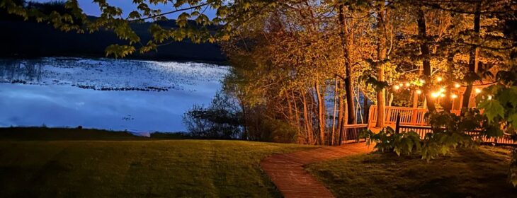 lighted gazebo and pond during evening in spring