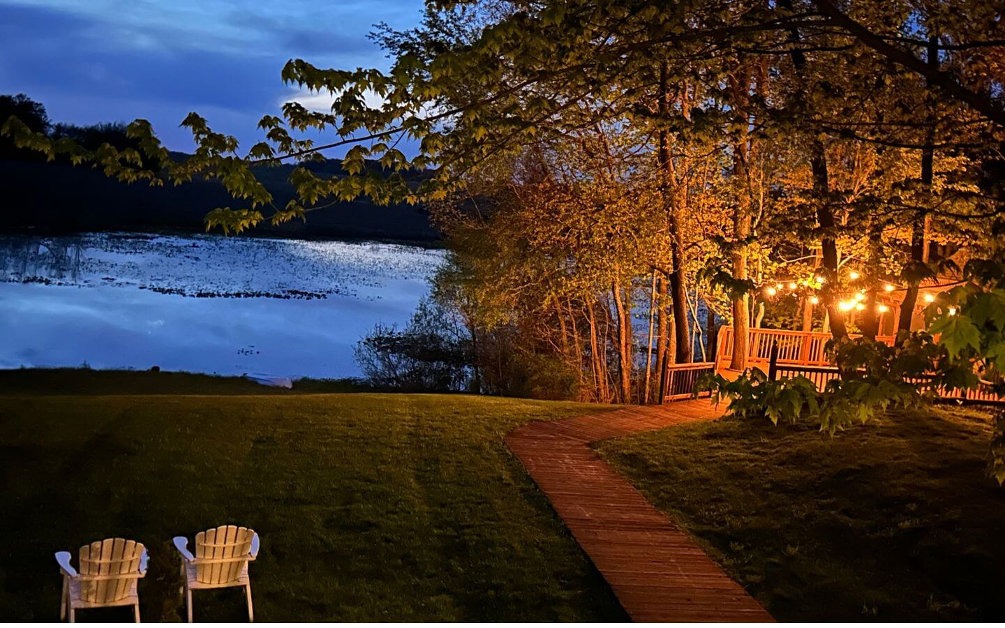 lighted gazebo and pond during evening in spring